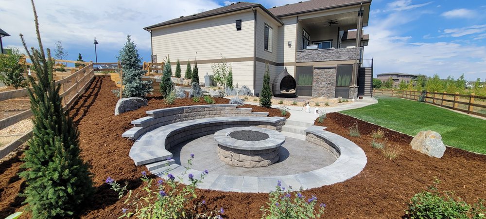 BolderScapes custom fire pit installation with professional landscaping in Berthoud, Colorado