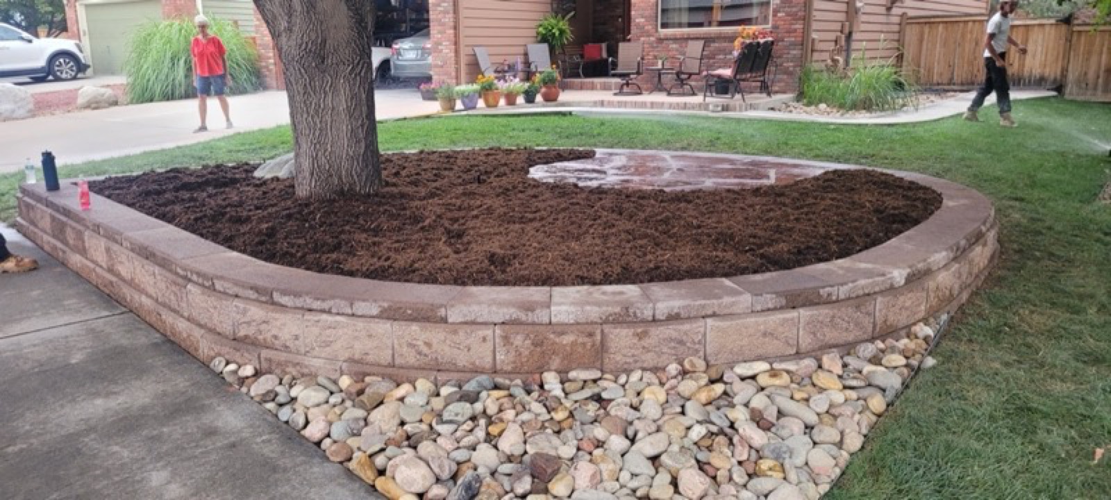 Curved retaining wall with landscaping